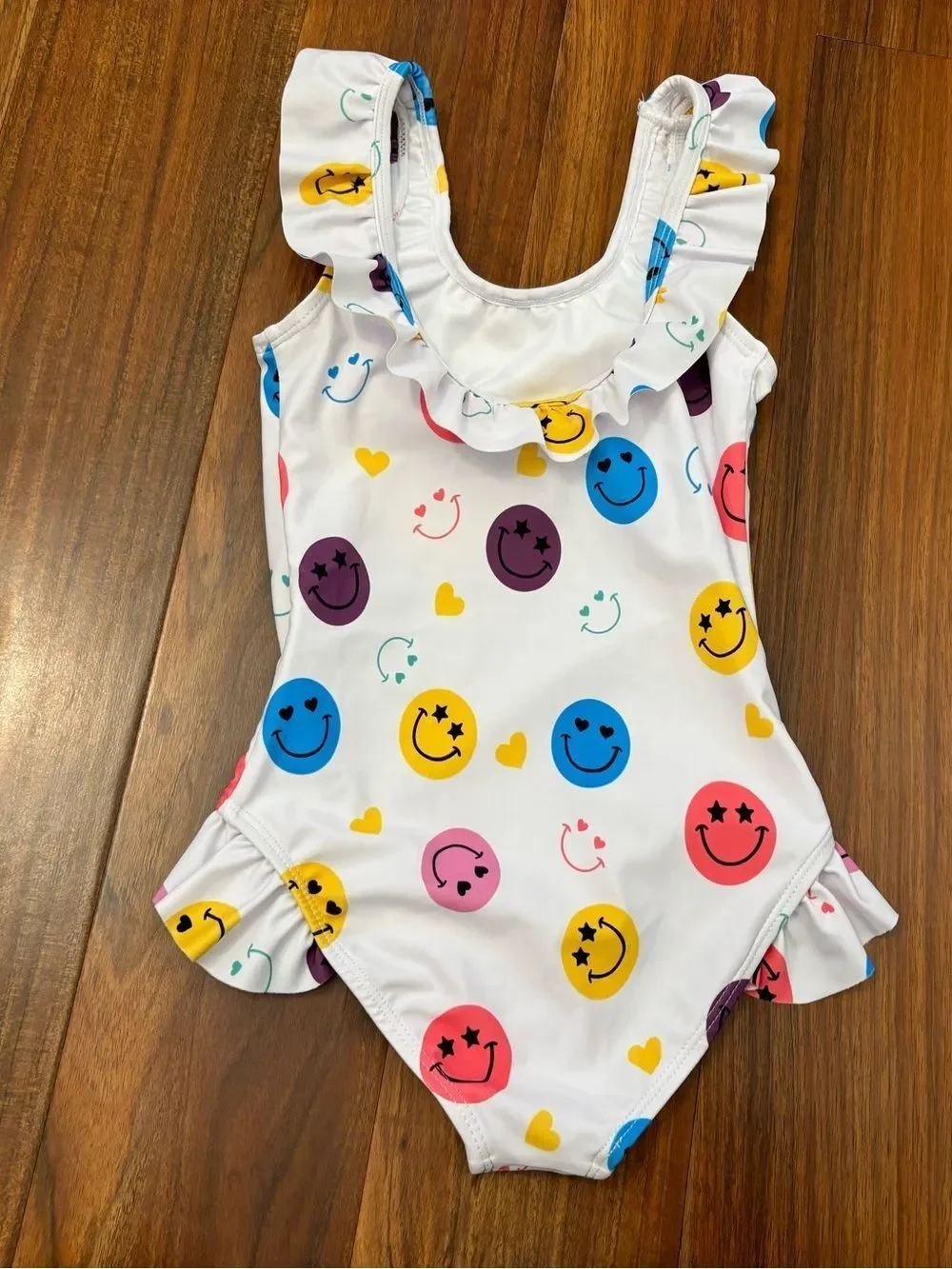 Lola + The Boys white smiley face one piece ruffle bathing suit